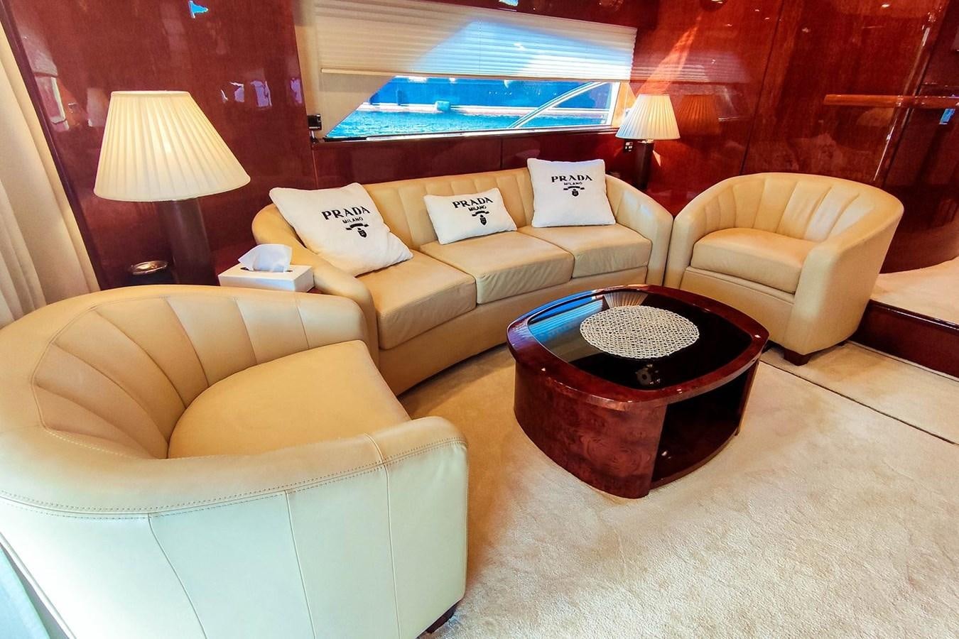 a room with a couch and a table aboard SEVEN Yacht for Sale