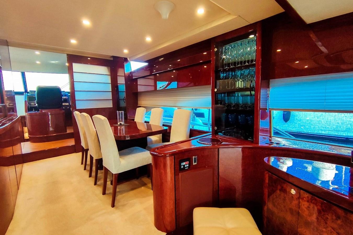 a bar with a table and chairs aboard SEVEN Yacht for Sale