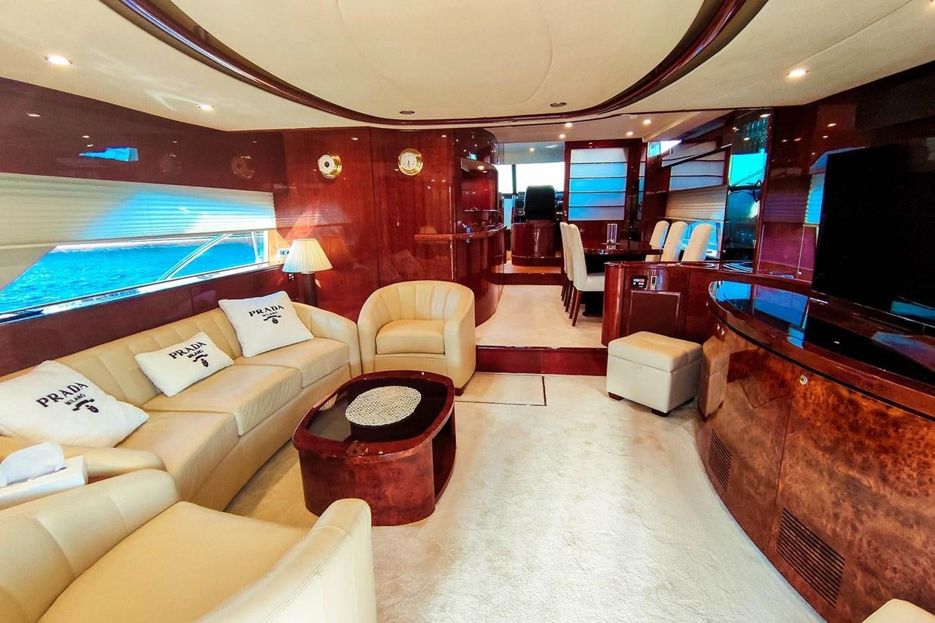 a room with a couch and a television aboard SEVEN Yacht for Sale