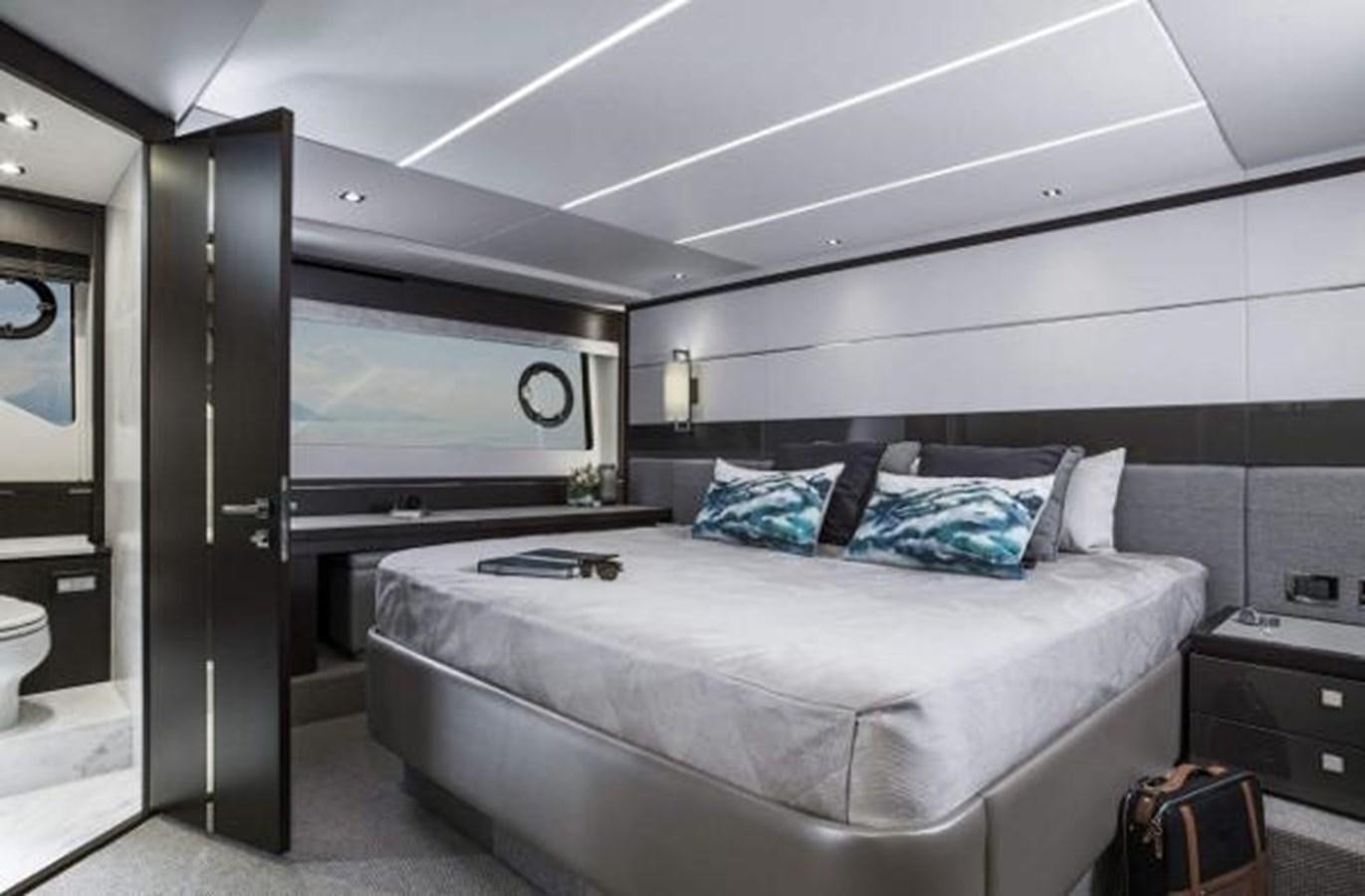 a bedroom with a bed aboard 74 PREDATOR Yacht for Sale