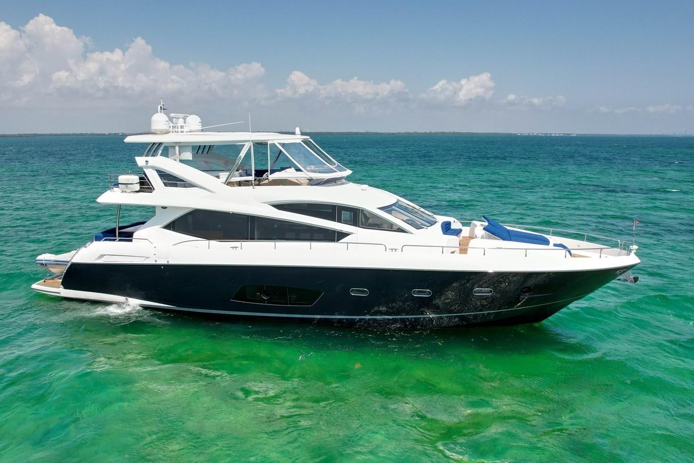 a boat in the water aboard SUNSEEKER 73 2013 Yacht for Sale