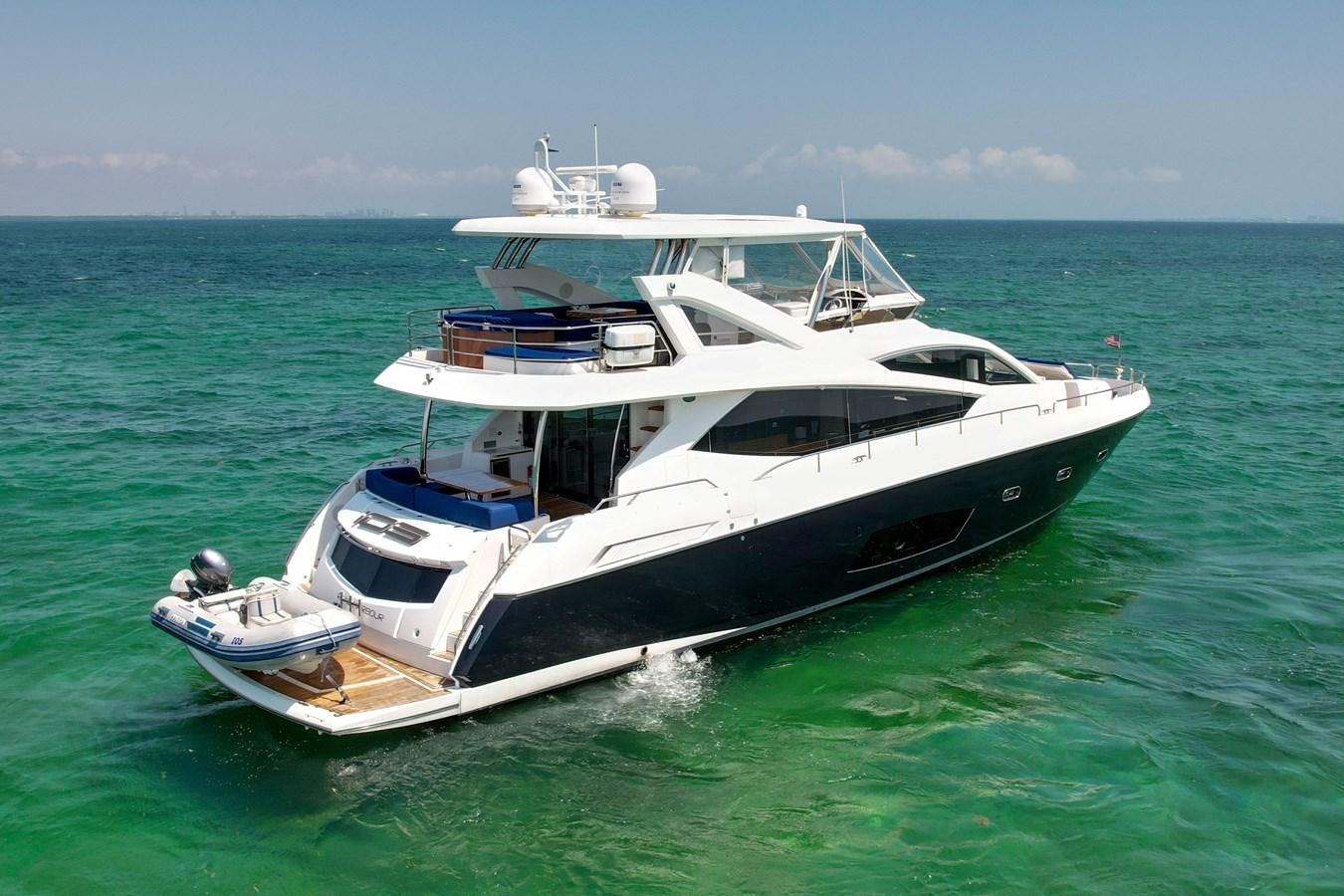 a boat in the water aboard SUNSEEKER 73 2013 Yacht for Sale