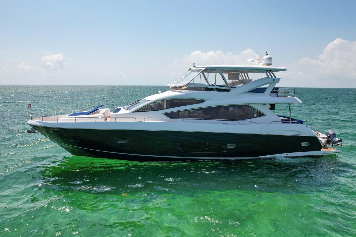 a boat in the water aboard SUNSEEKER 73 2013 Yacht for Sale