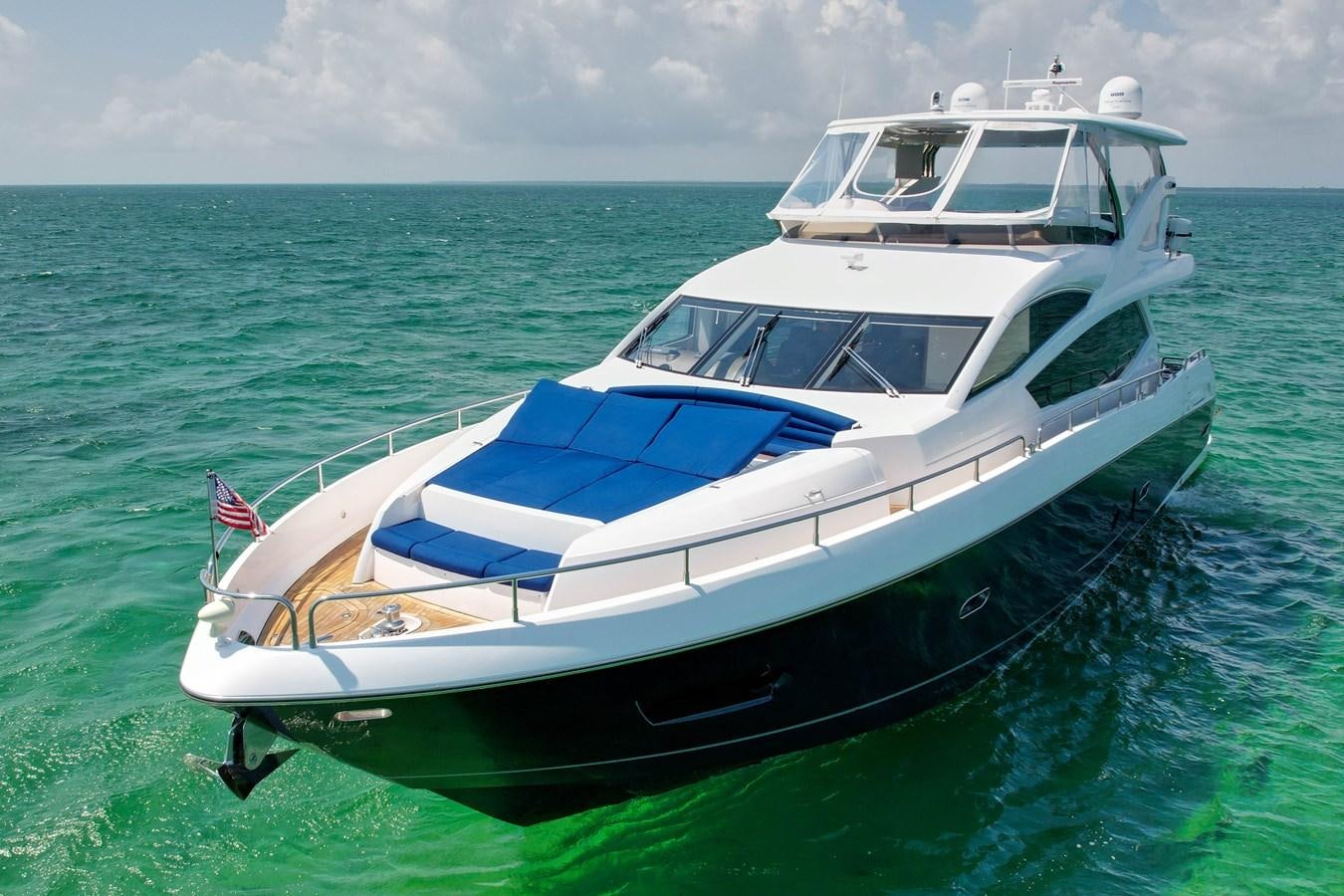 a boat in the water aboard SUNSEEKER 73 2013 Yacht for Sale