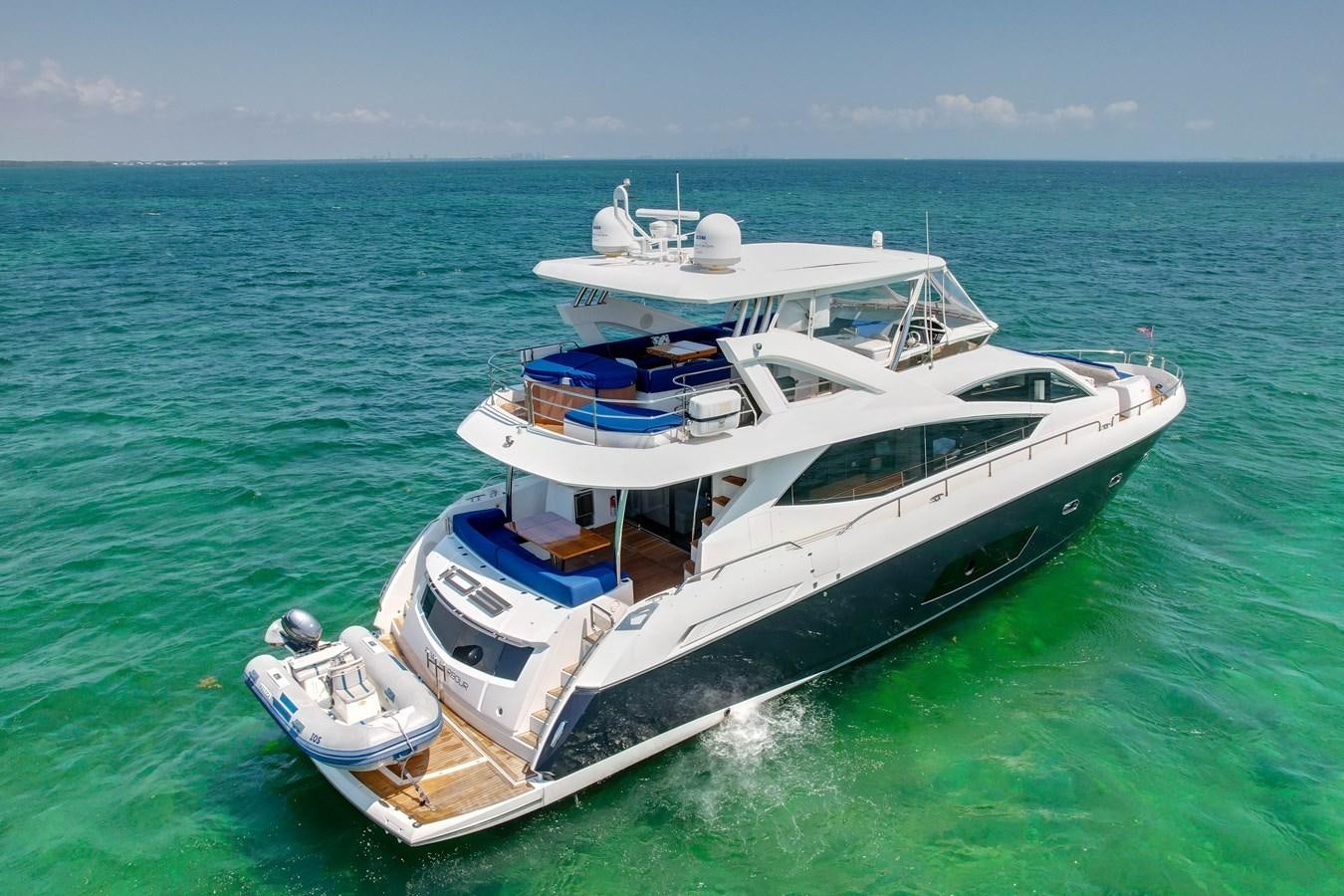 a boat in the water aboard SUNSEEKER 73 2013 Yacht for Sale
