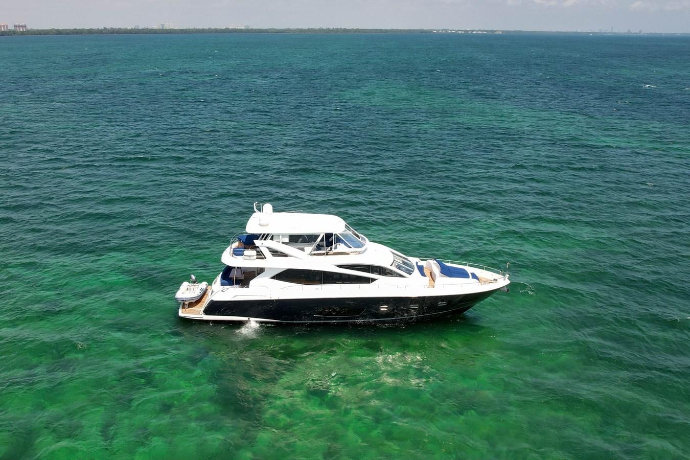 a small boat in the water aboard SUNSEEKER 73 2013 Yacht for Sale
