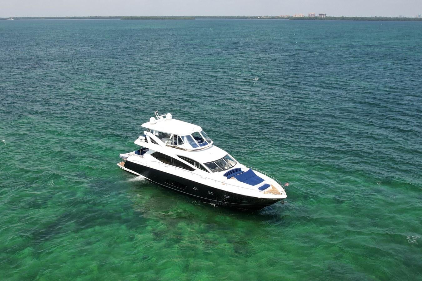 a boat in the water aboard SUNSEEKER 73 2013 Yacht for Sale