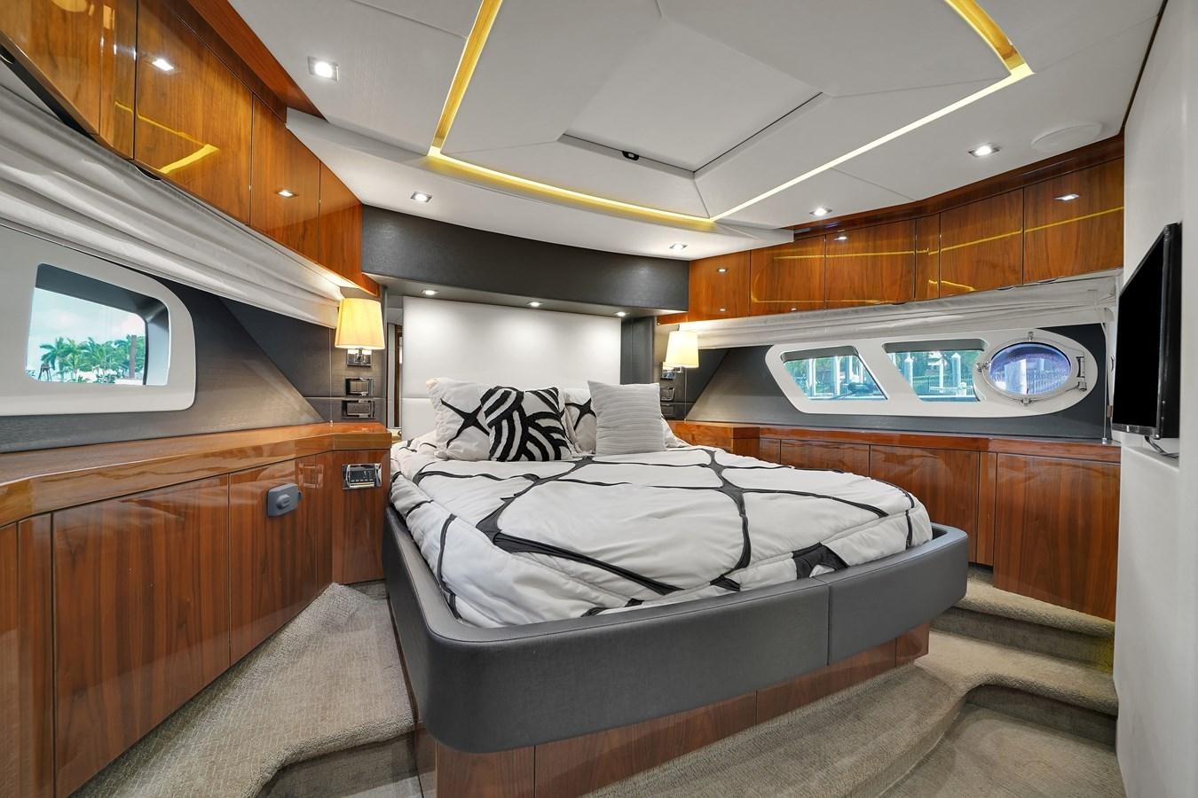 a bed in a room aboard SUNSEEKER 73 2013 Yacht for Sale