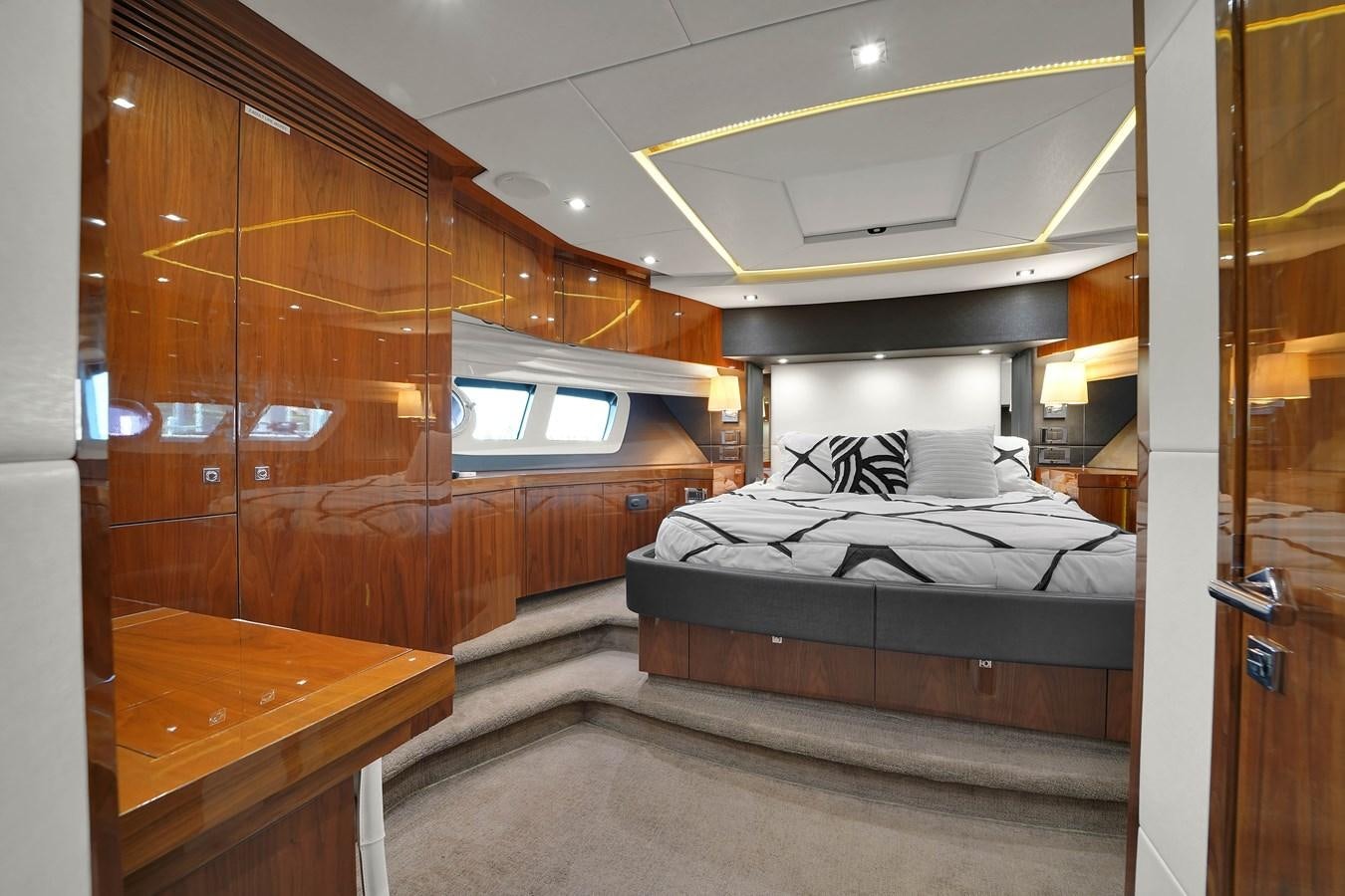 a bedroom with wood walls aboard SUNSEEKER 73 2013 Yacht for Sale
