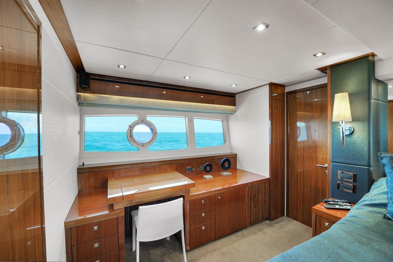 a room with a desk and a chair aboard SUNSEEKER 73 2013 Yacht for Sale