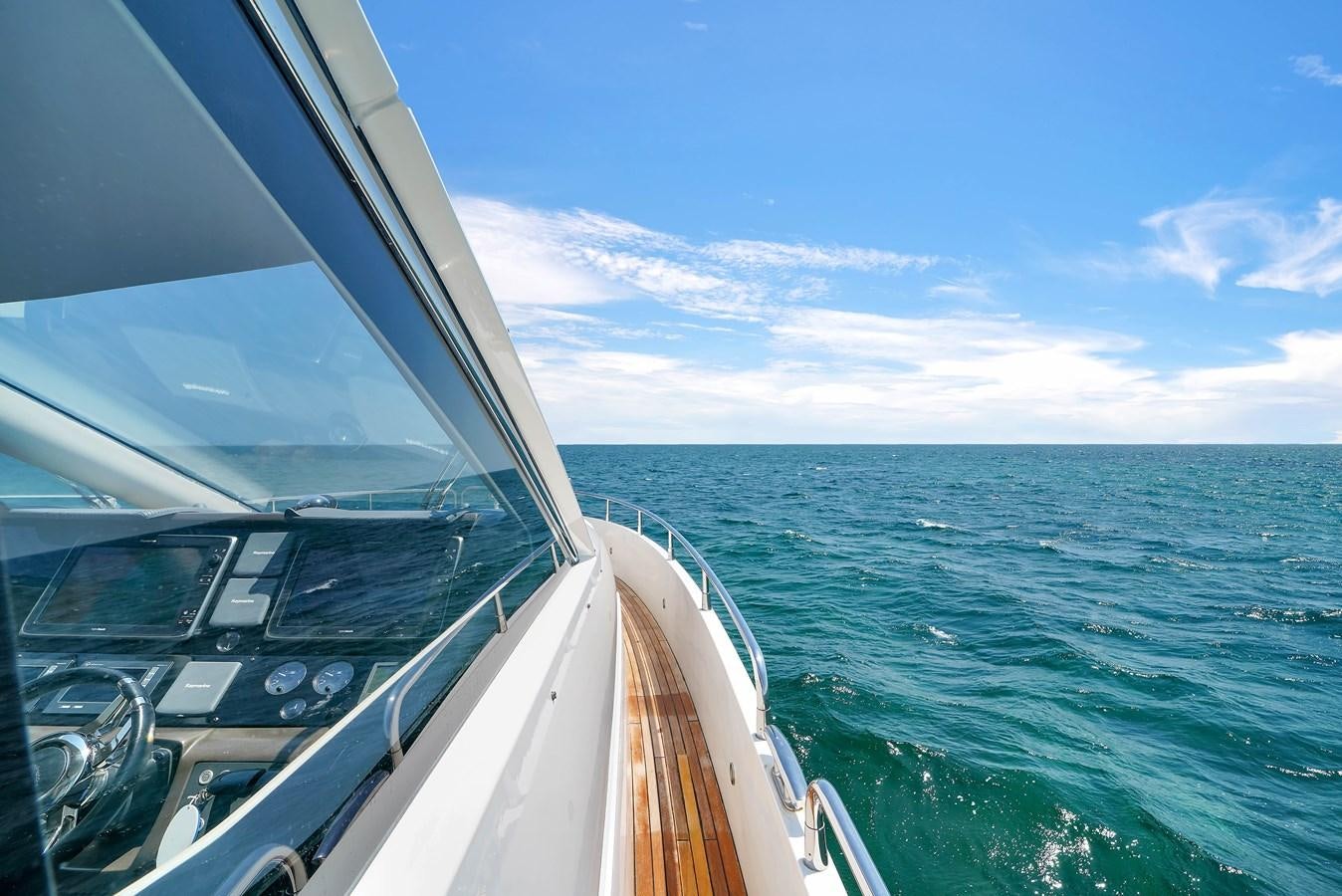 a boat on the water aboard SUNSEEKER 73 2013 Yacht for Sale