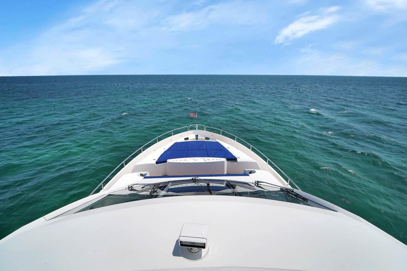 a white boat in the water aboard SUNSEEKER 73 2013 Yacht for Sale