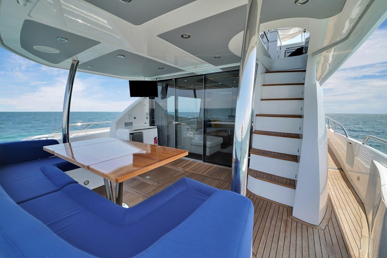a boat on the water aboard SUNSEEKER 73 2013 Yacht for Sale