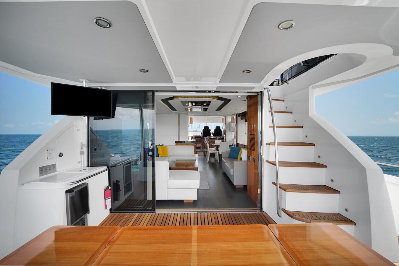 a boat with a staircase and a boat in the water aboard SUNSEEKER 73 2013 Yacht for Sale
