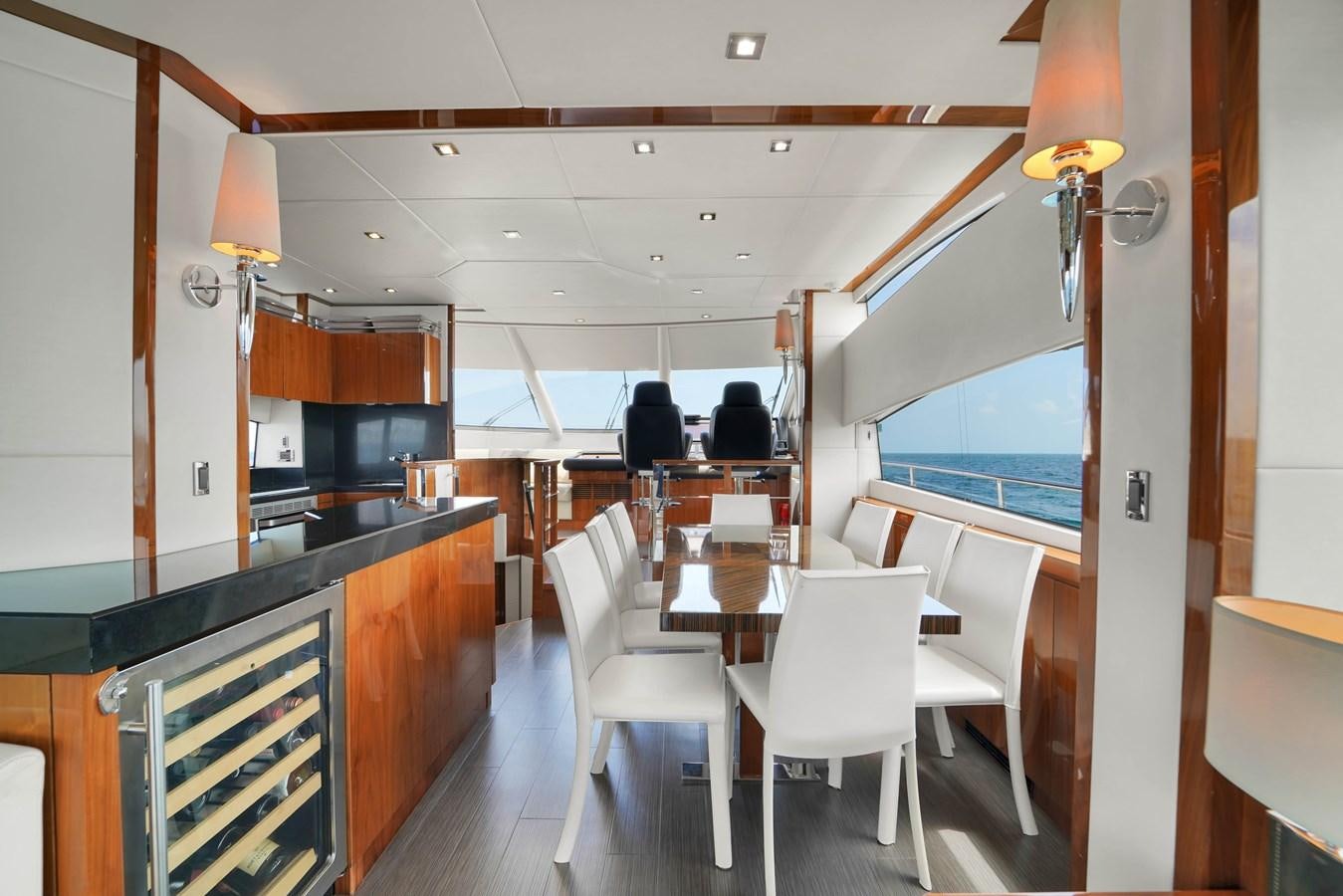 a kitchen and dining area aboard SUNSEEKER 73 2013 Yacht for Sale