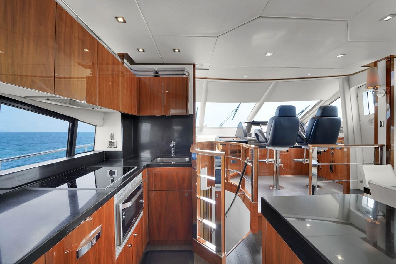 a kitchen with a large island aboard SUNSEEKER 73 2013 Yacht for Sale