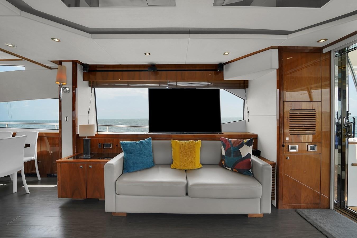 a living room with a couch aboard SUNSEEKER 73 2013 Yacht for Sale