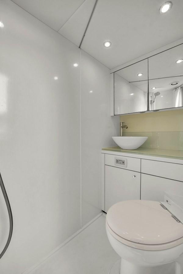 a bathroom with a sink and toilet aboard SUNSEEKER 73 2013 Yacht for Sale
