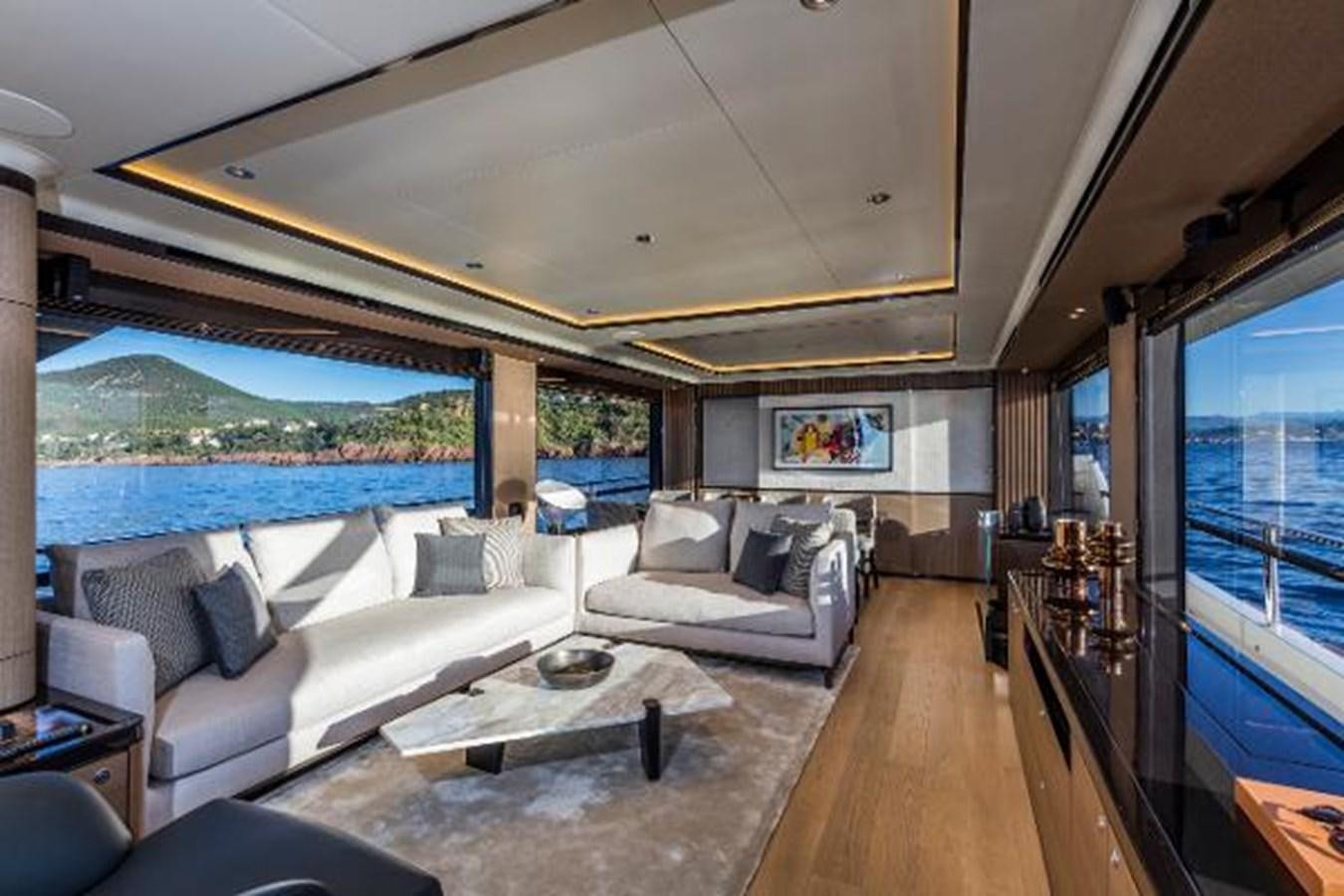 a living room with a large window aboard 73 NAVETTA Yacht for Sale