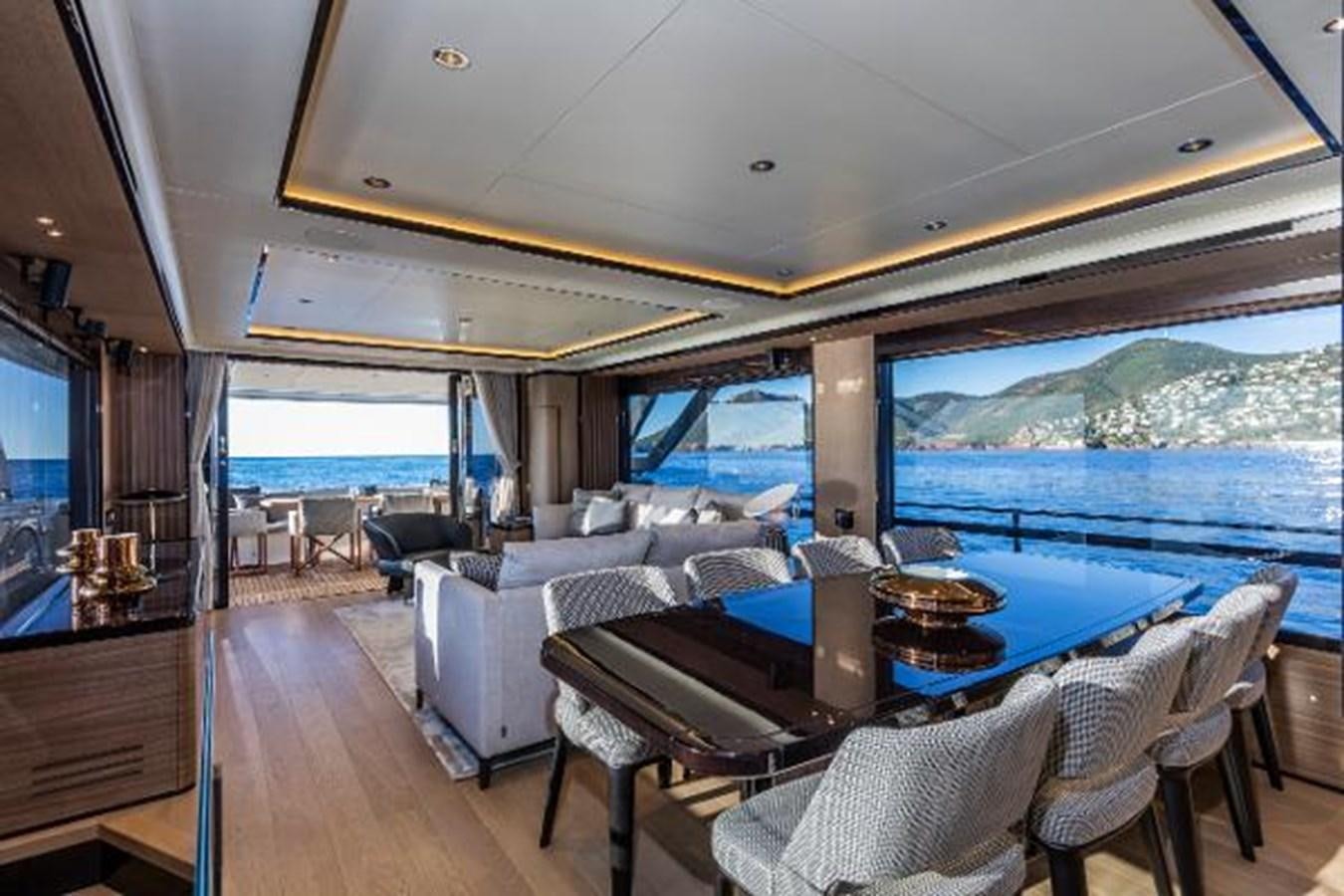 a large living room with a large blue ocean view aboard 73 NAVETTA Yacht for Sale
