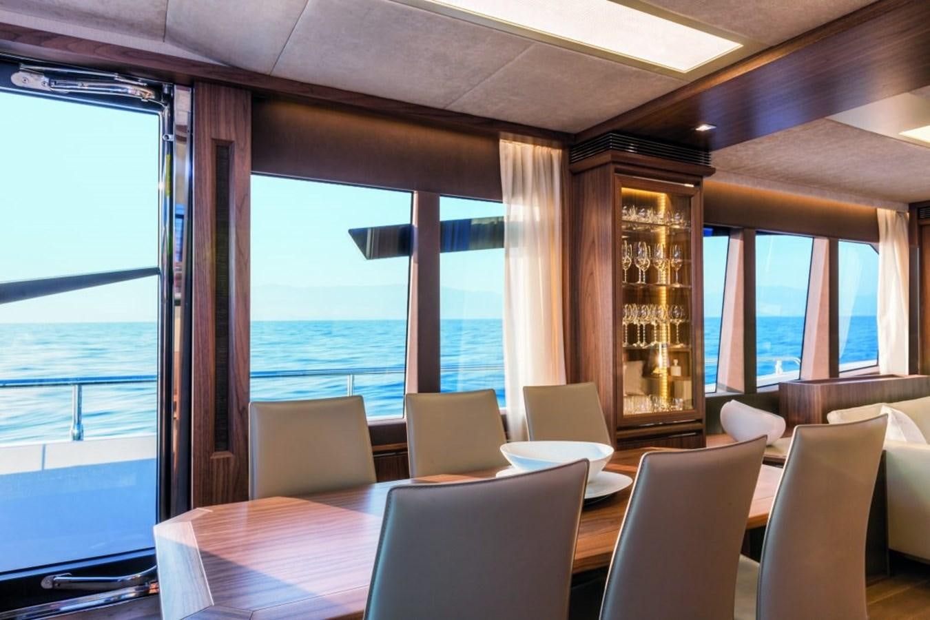 a room with a large window and a view of the ocean aboard 72 FLY Yacht for Sale