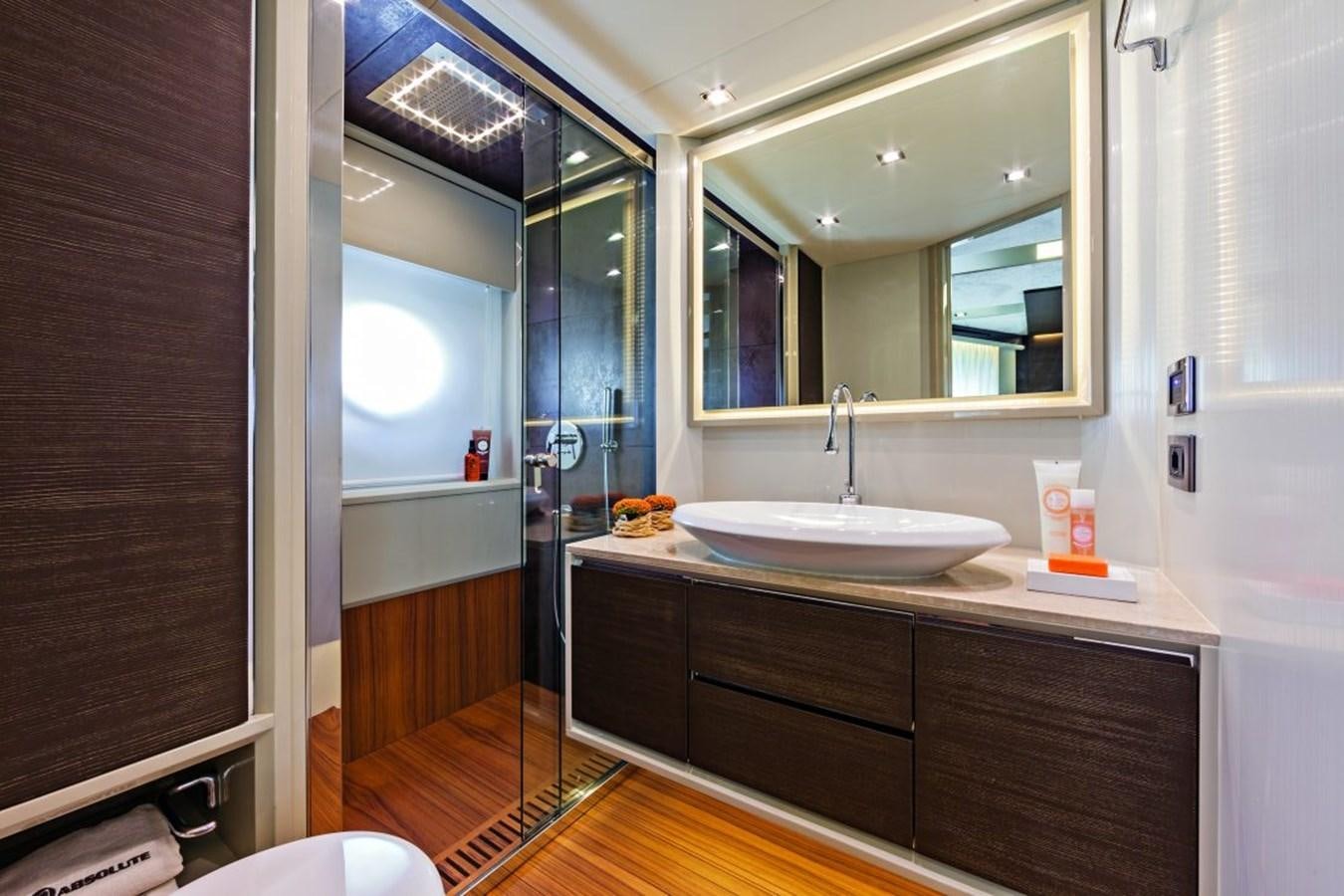a bathroom with a large mirror aboard 72 FLY Yacht for Sale