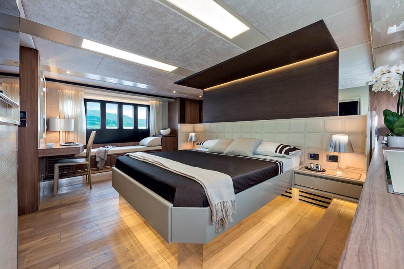 a room with a bed and a desk aboard 72 FLY Yacht for Sale