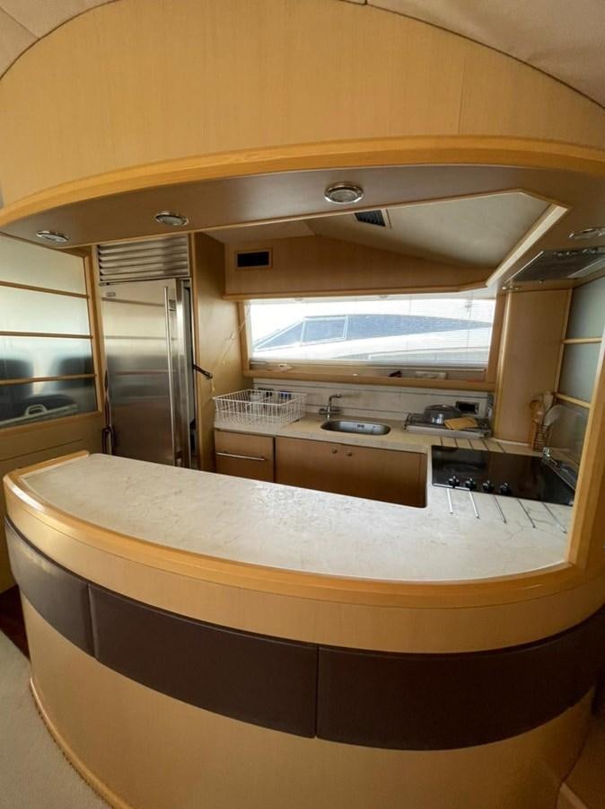 a large kitchen with a large window aboard SEA HUSSEIN Yacht for Sale
