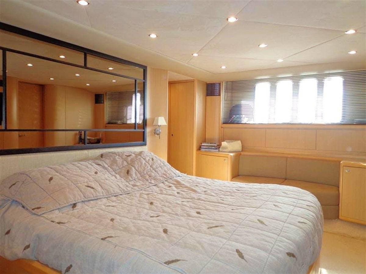a bedroom with a large mirror aboard SEA HUSSEIN Yacht for Sale