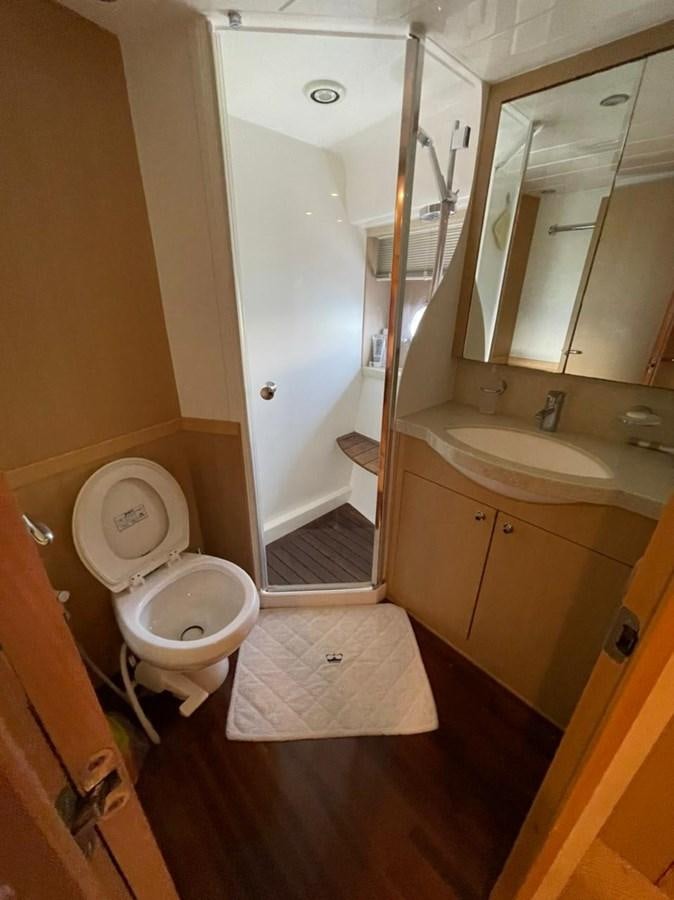 a bathroom with a toilet and sink aboard SEA HUSSEIN Yacht for Sale