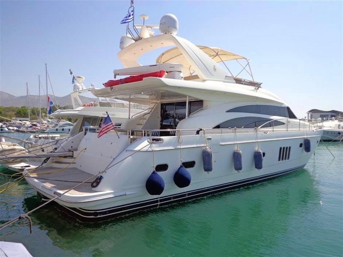 a large white boat in a harbor aboard SEA HUSSEIN Yacht for Sale