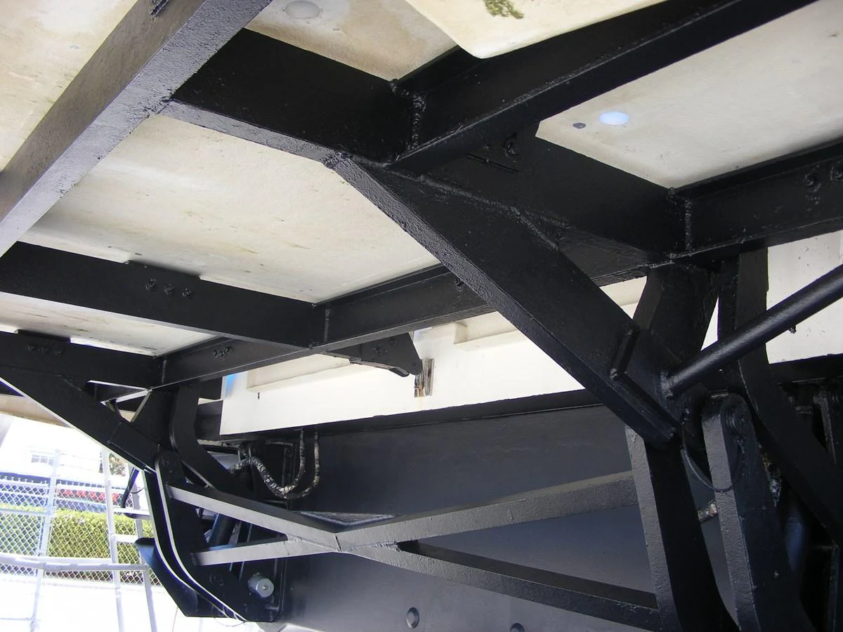 a close-up of a black and white staircase aboard GRAVITAS Yacht for Sale