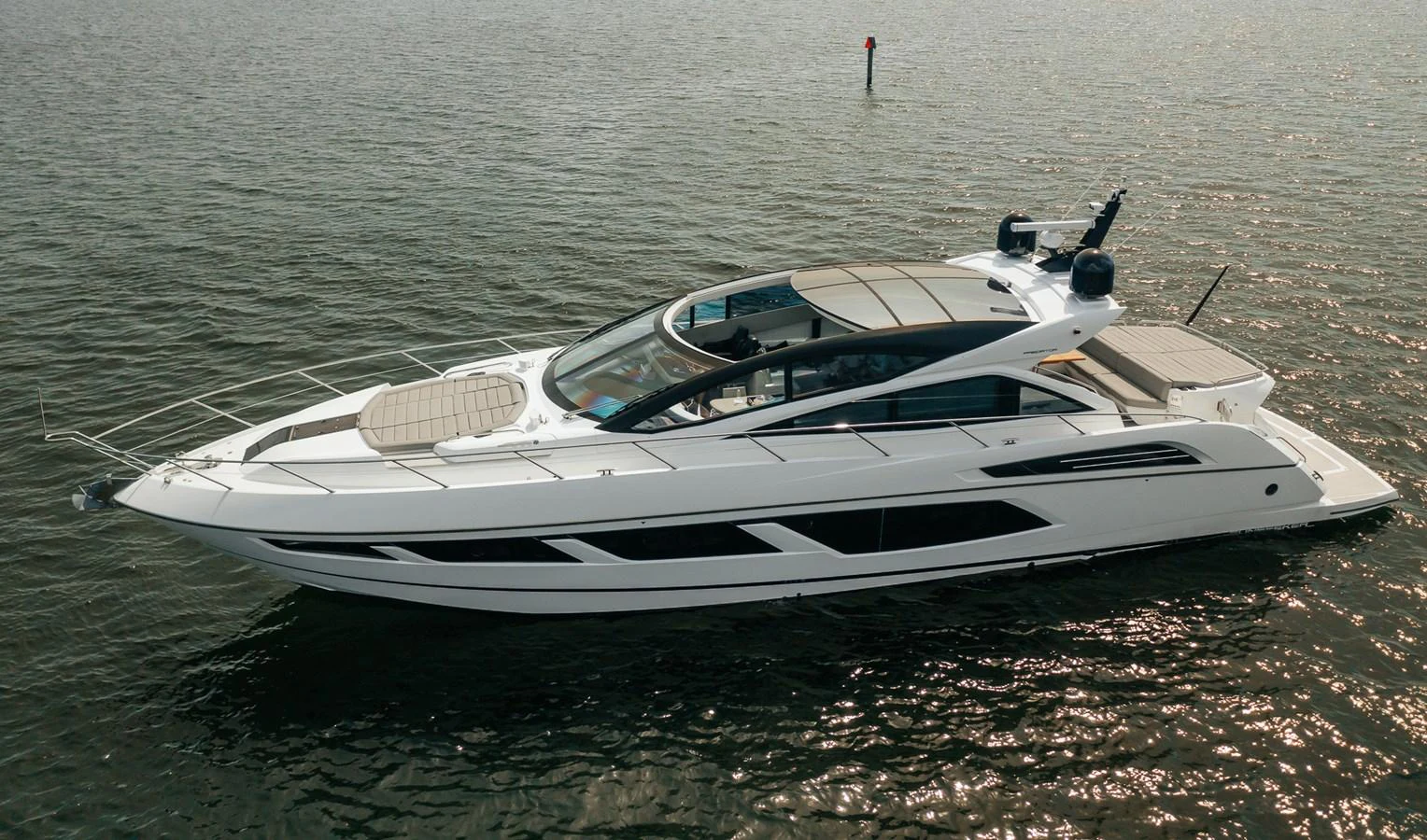 a white boat on the water aboard GRAVITAS Yacht for Sale