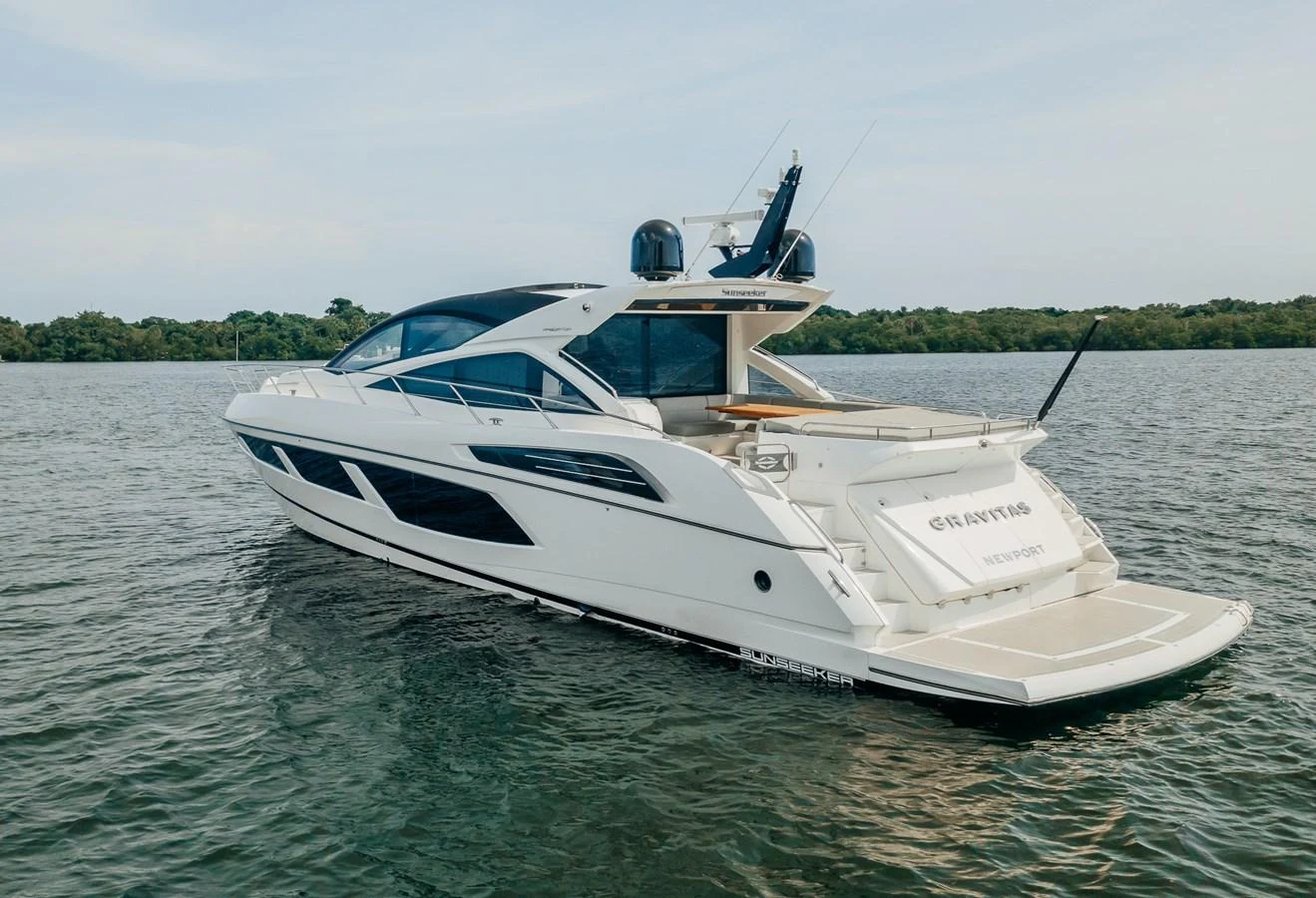 a white boat on water aboard GRAVITAS Yacht for Sale