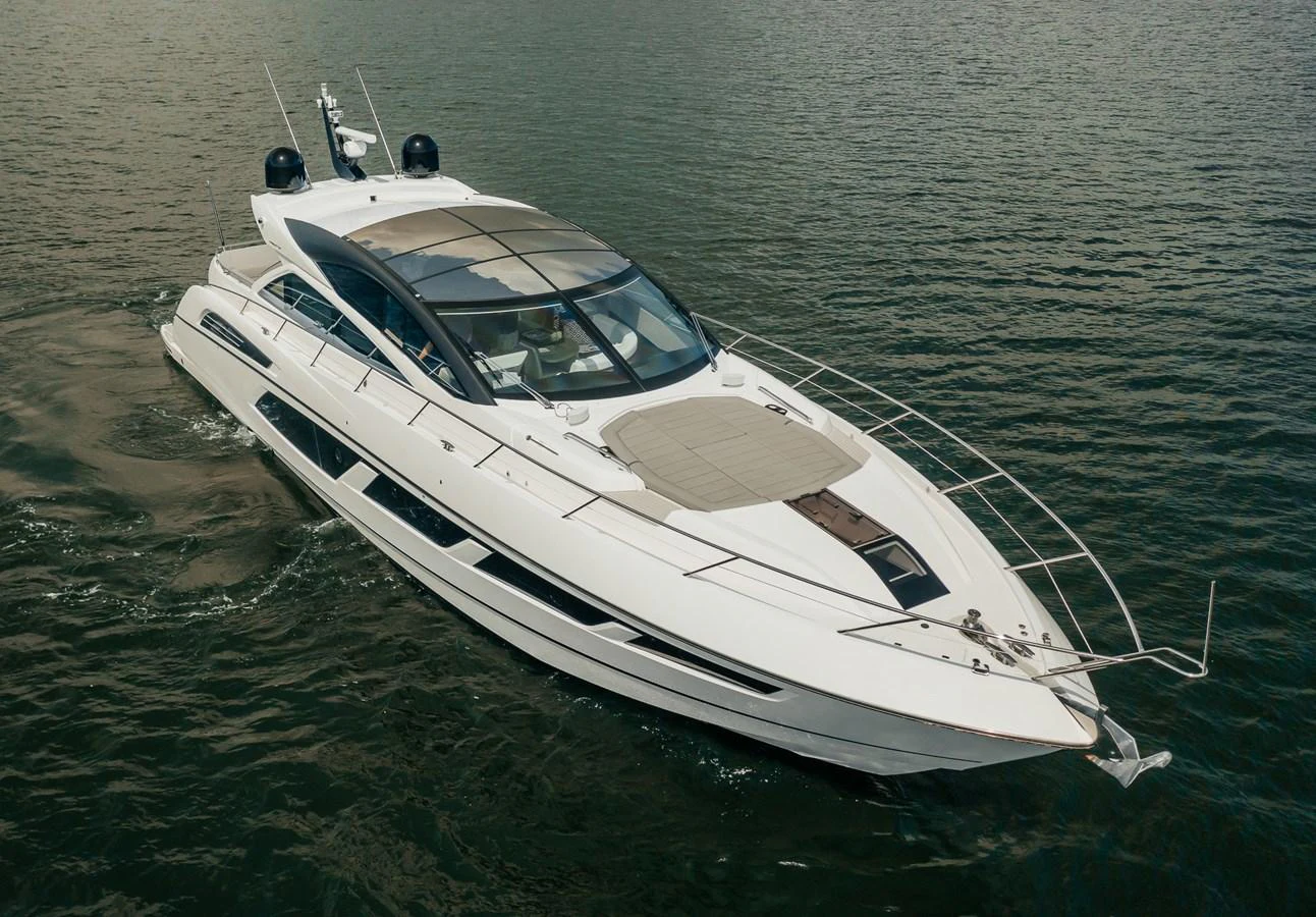 a white boat in the water aboard GRAVITAS Yacht for Sale