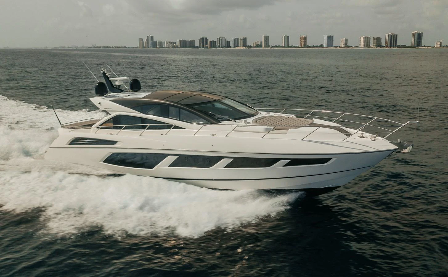 a white yacht on the water aboard GRAVITAS Yacht for Sale