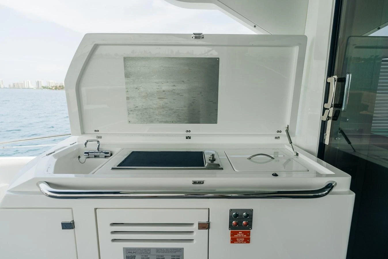 a white microwave on a boat aboard GRAVITAS Yacht for Sale