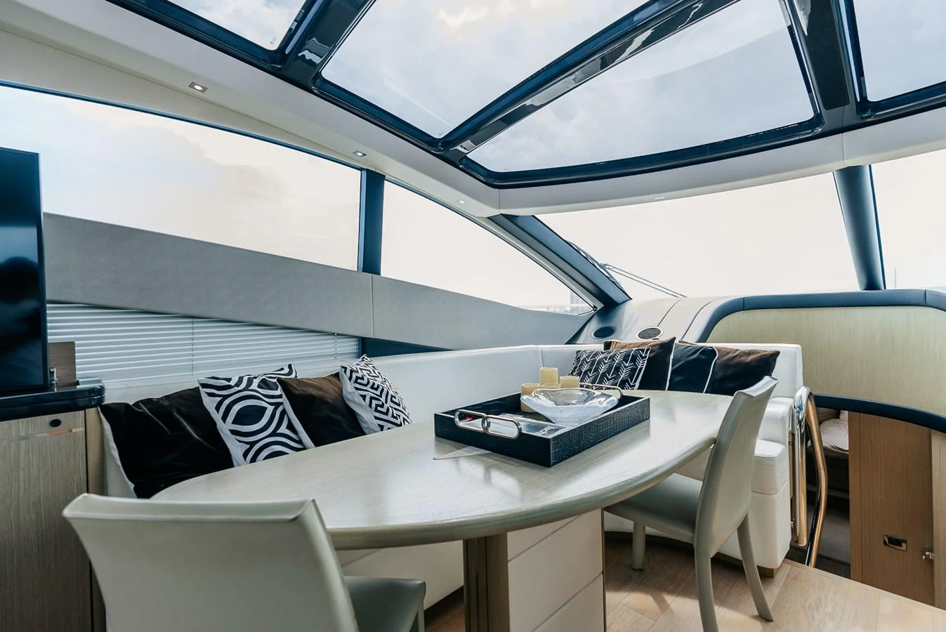 a room with a table and chairs aboard GRAVITAS Yacht for Sale