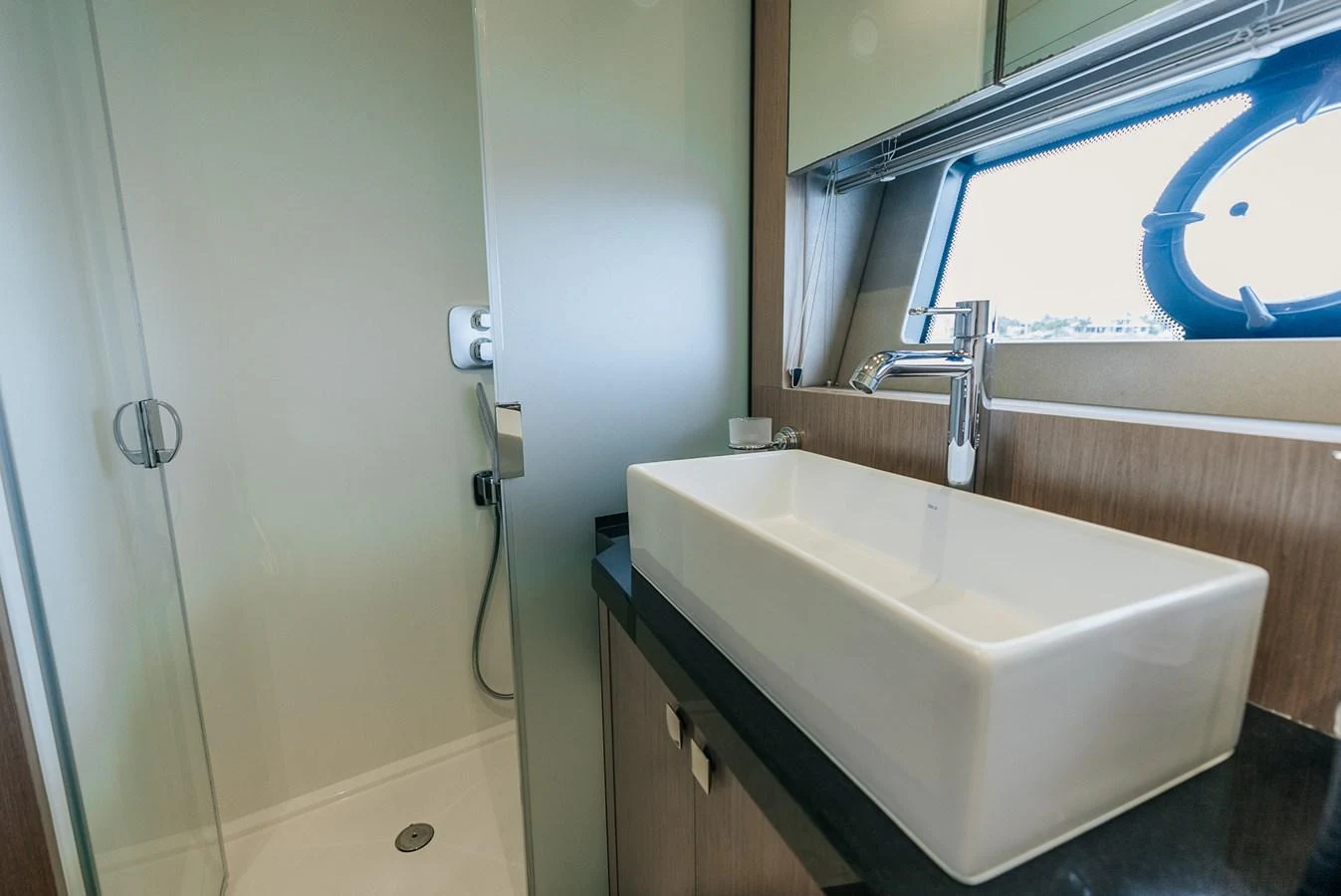 a bathroom with a sink and a mirror aboard GRAVITAS Yacht for Sale