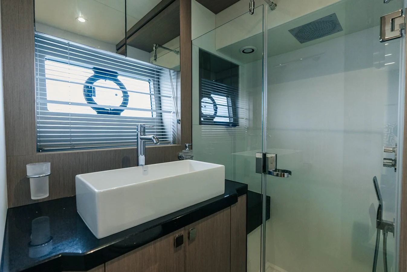 a bathroom with a sink and a shower aboard GRAVITAS Yacht for Sale