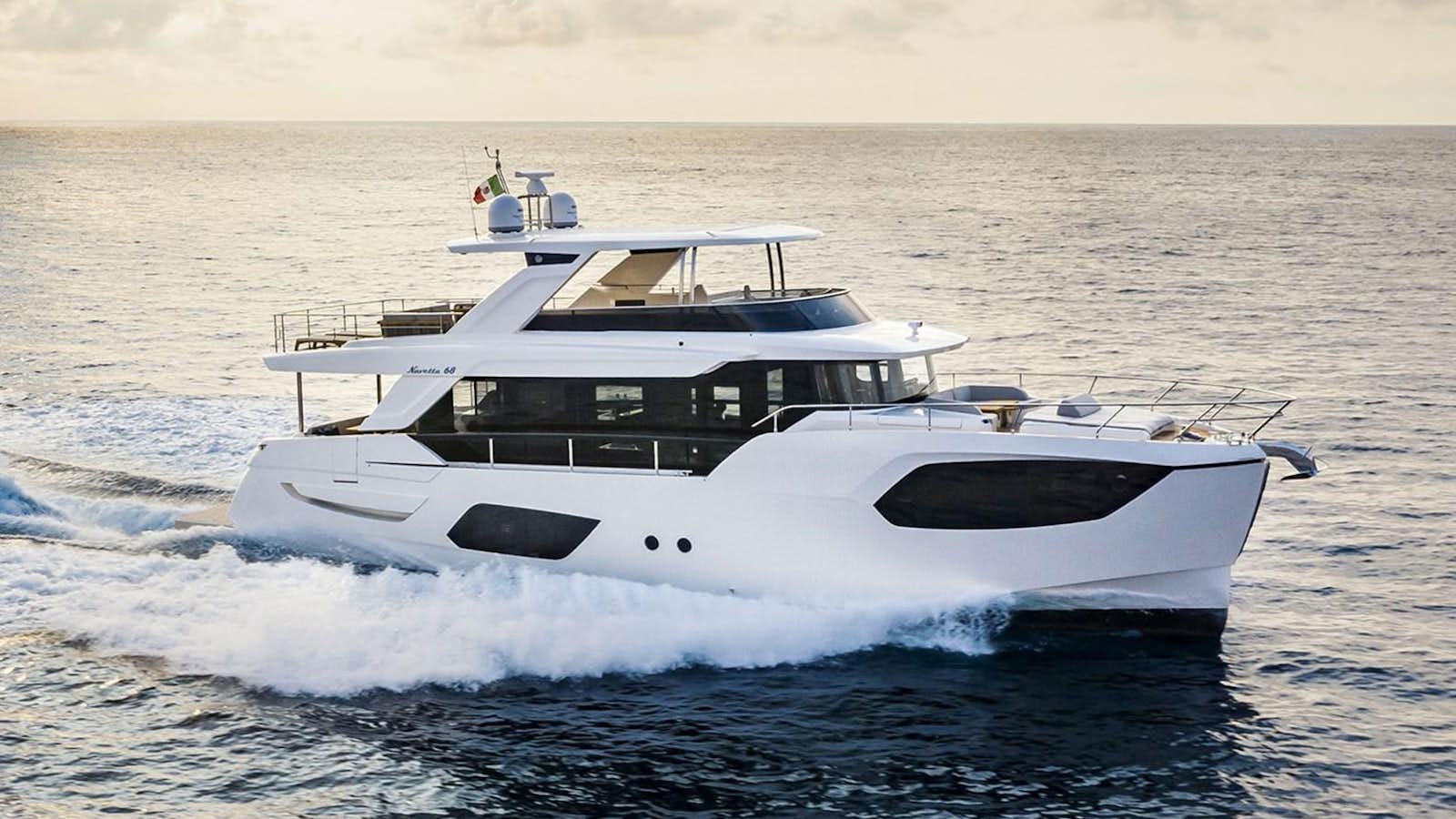 a white boat in the water aboard 68 NAVETTA Yacht for Sale