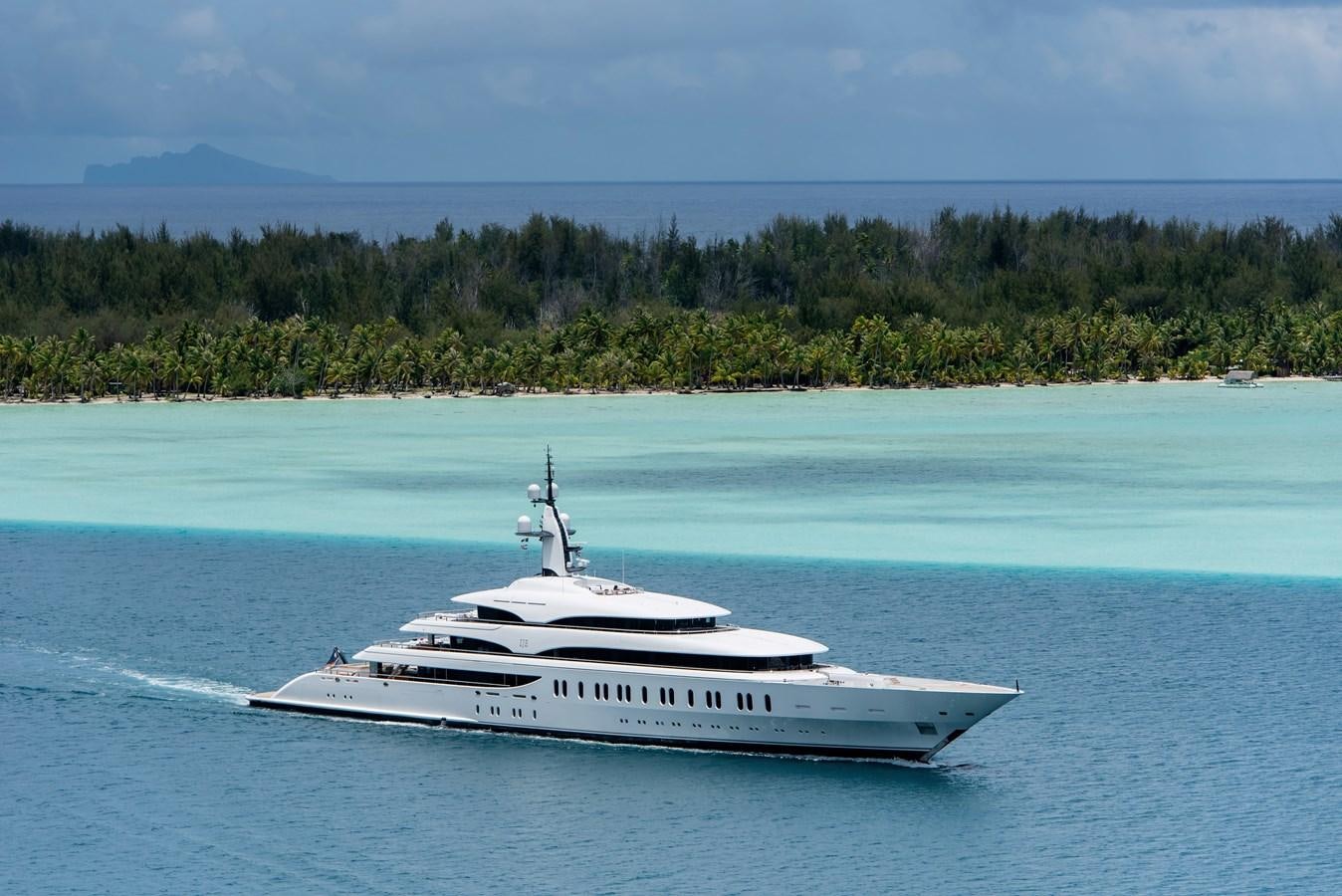 a white boat on the water aboard IJE Yacht for Sale