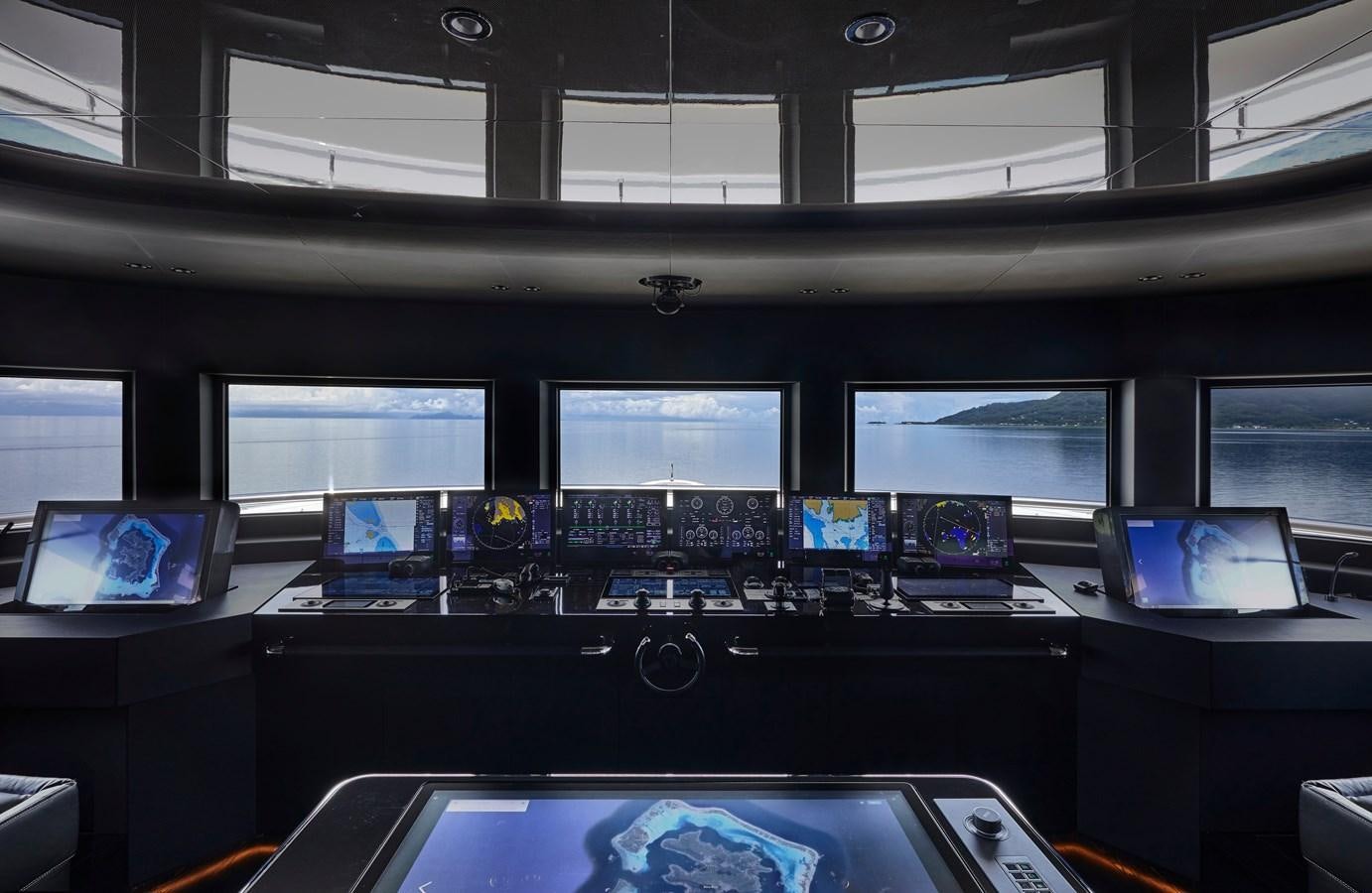 a room with computers and monitors aboard IJE Yacht for Sale