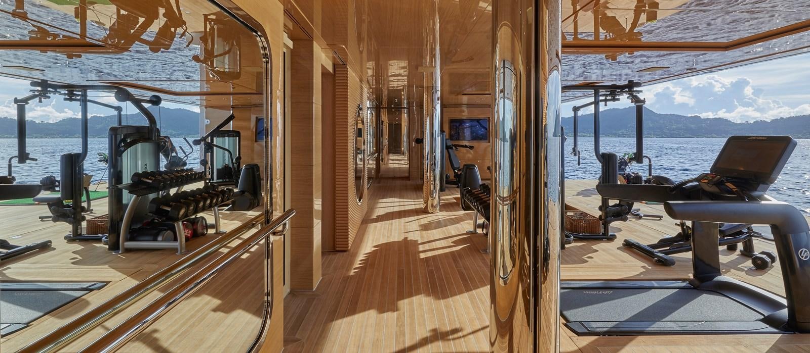 a deck with a deck and a large pool of water aboard IJE Yacht for Sale