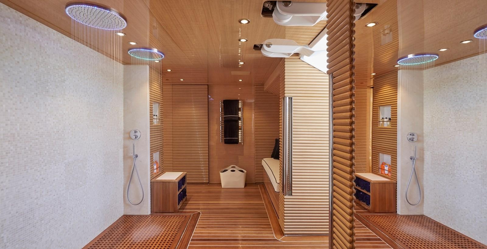a room with a wood floor and a wood door aboard IJE Yacht for Sale