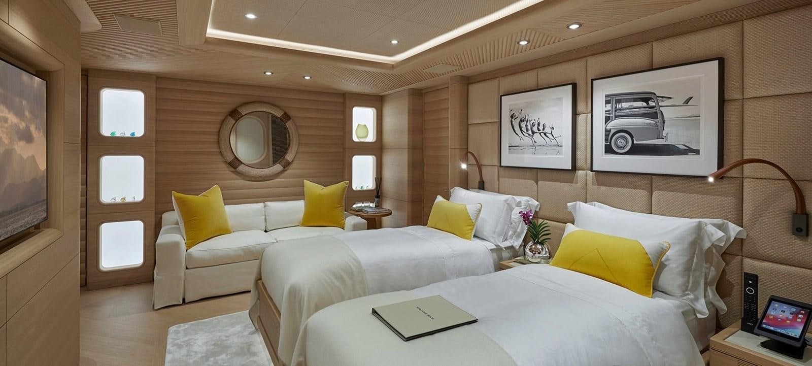 a room with two beds aboard IJE Yacht for Sale