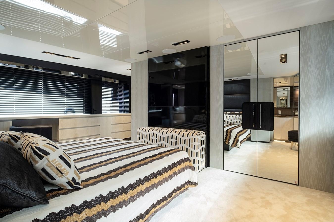 a room with a bed and a tv aboard ALIX Yacht for Sale