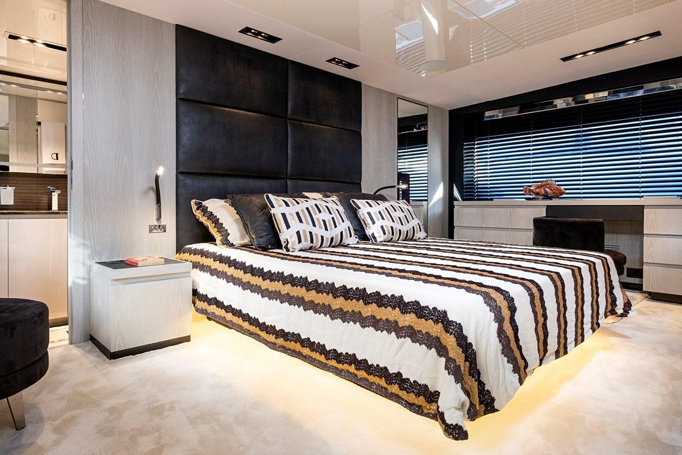 a large bedroom with a large bed aboard ALIX Yacht for Sale