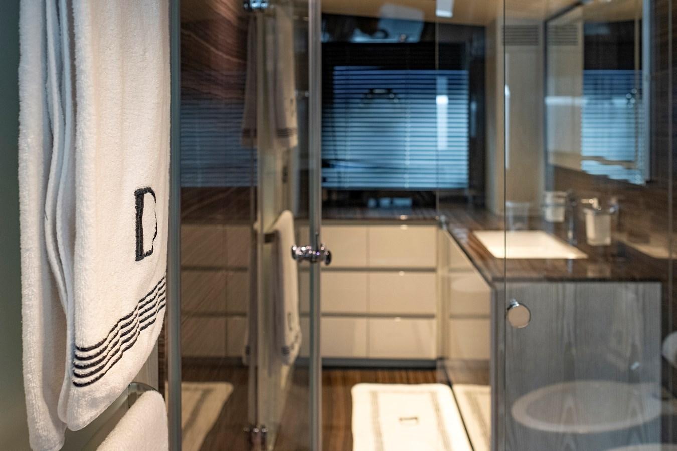 a bathroom with a sink and a mirror aboard ALIX Yacht for Sale
