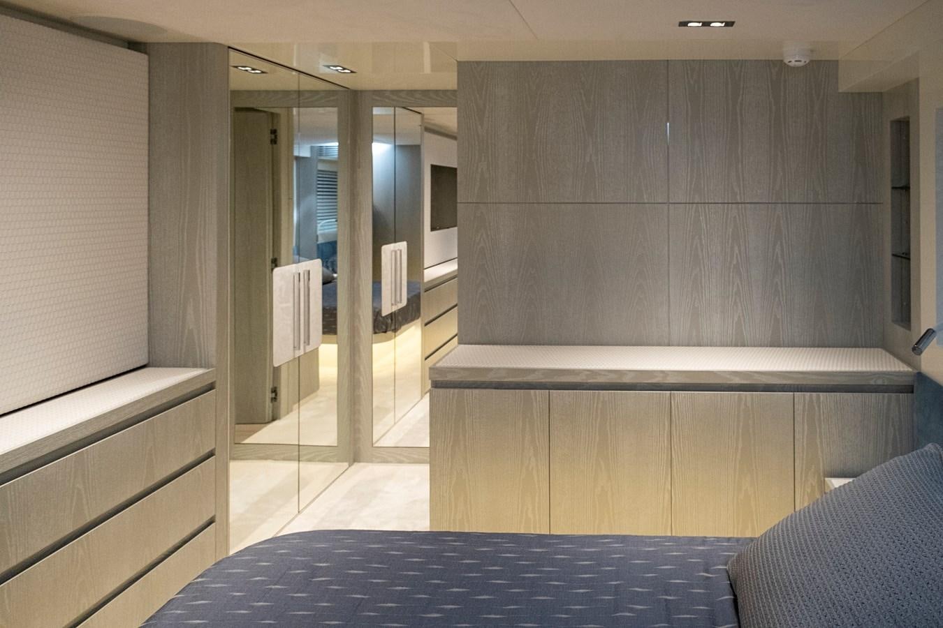 a room with a bed and a closet aboard ALIX Yacht for Sale
